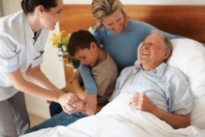 Older patient receiving gentle comfort care from a nurse