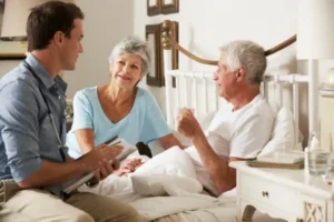 Nurse comforting an older patient in a calm room