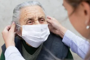 Caregiver offering comfort care to an older adult