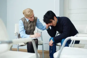 Person sitting alone feeling sad and withdrawn
