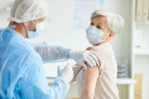 Clinician providing care to a woman at home