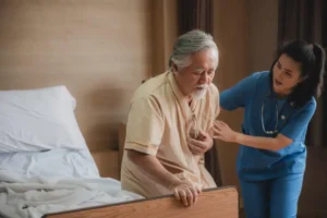 Older man with heart disease holding his chest