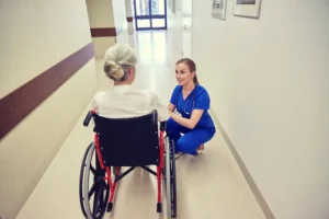 Nurse with an older woman in a wheelchair