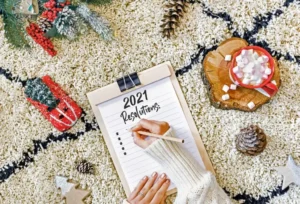 Hand writing notes in a notebook