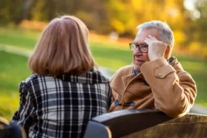 Older couple talking together about health and care goals
