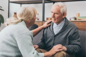 Nurse taking care of patient with Parkinson's dementia end stage in Hospice