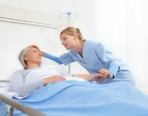 Family member comforting a loved one receiving hospice care at home