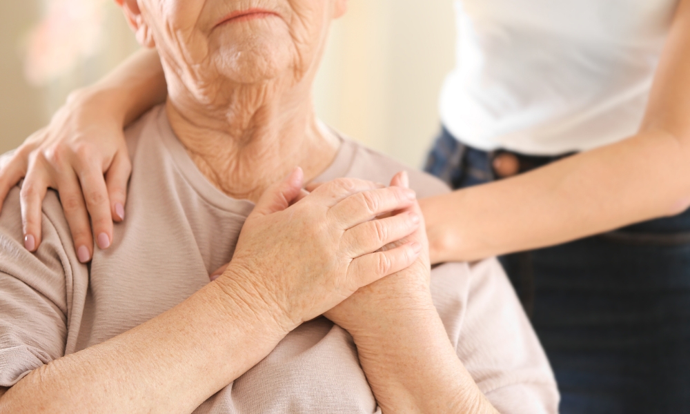 Hospice team providing support to cancer patient and family