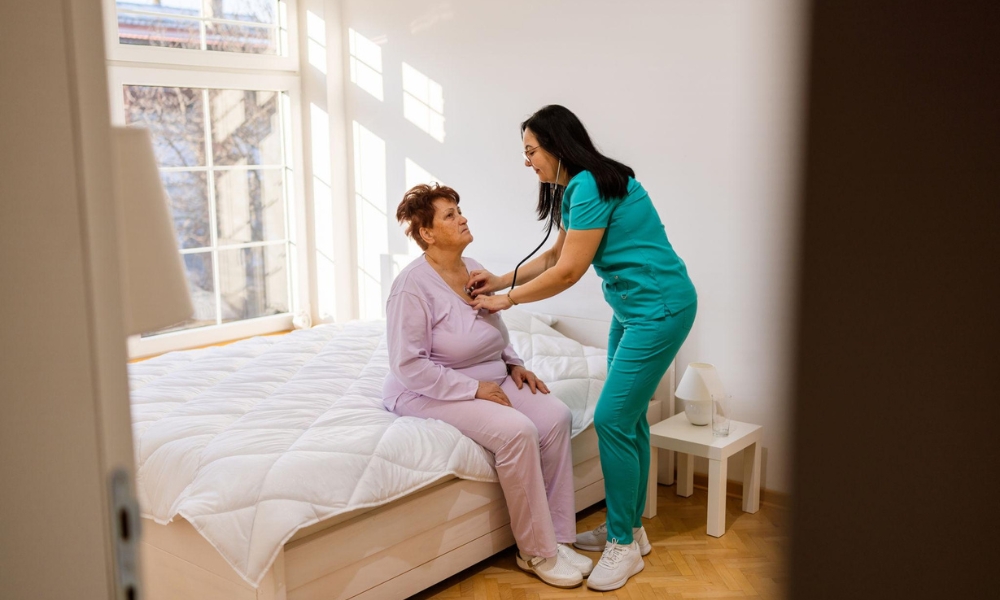 Hospice nurse supporting patient with advanced heart failure at home
