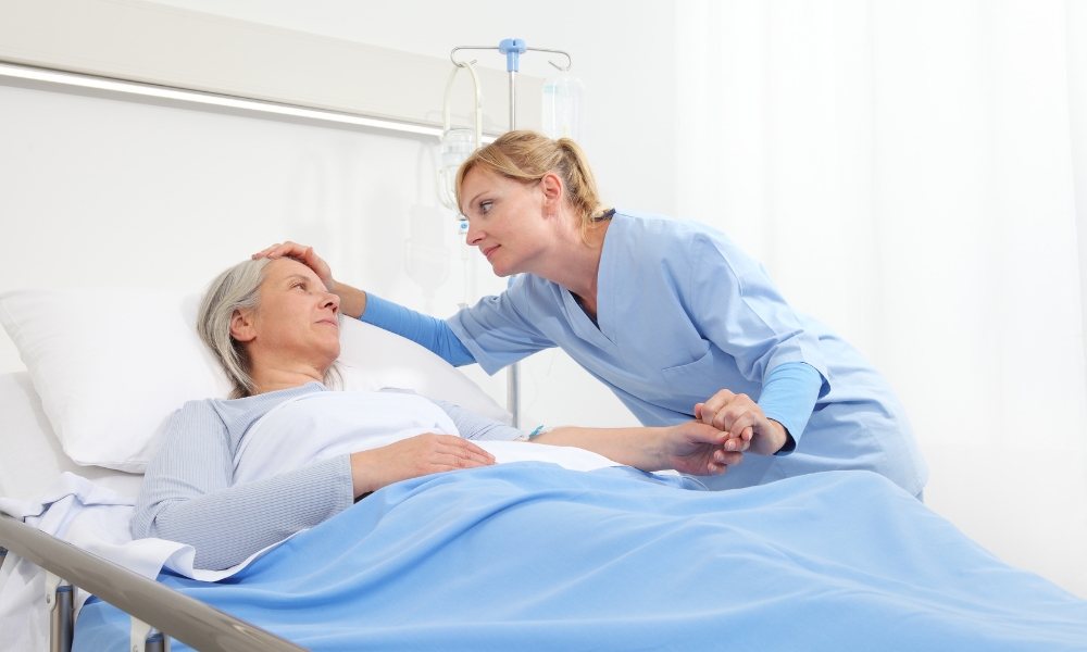 Hospice nurse discussing care plan with patient and family at home