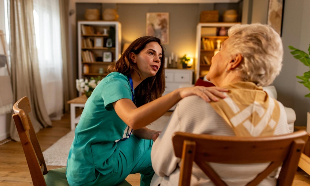 Doctor discussing hospice care with family in hospital room