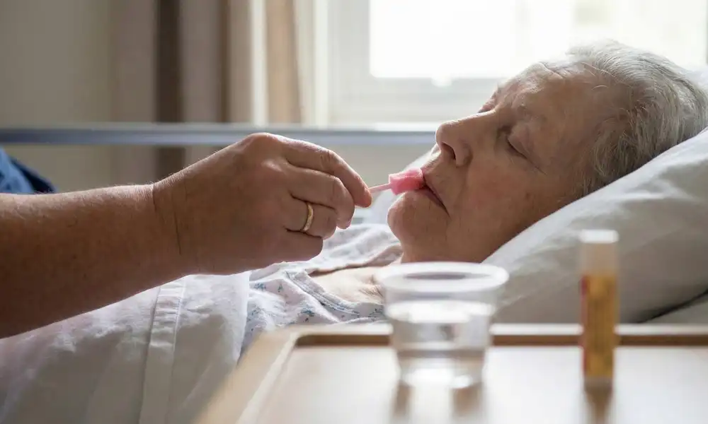 Hospice nurse supporting patient and family at home during care planning
